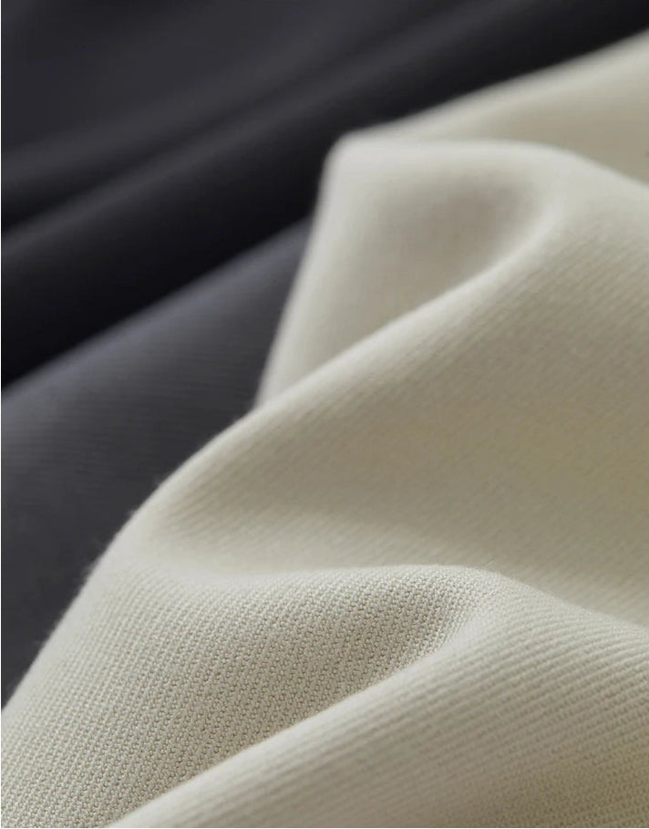 Wave folded textures of the tailored loose-fitting trousers in available colors. — From Borcelleclothes.