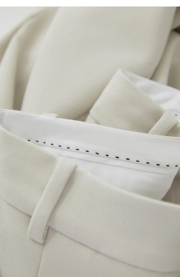Folded waistband of Moon Mist trousers — close-up reveals fabric structure and precise finishing. From Borcelleclothes.