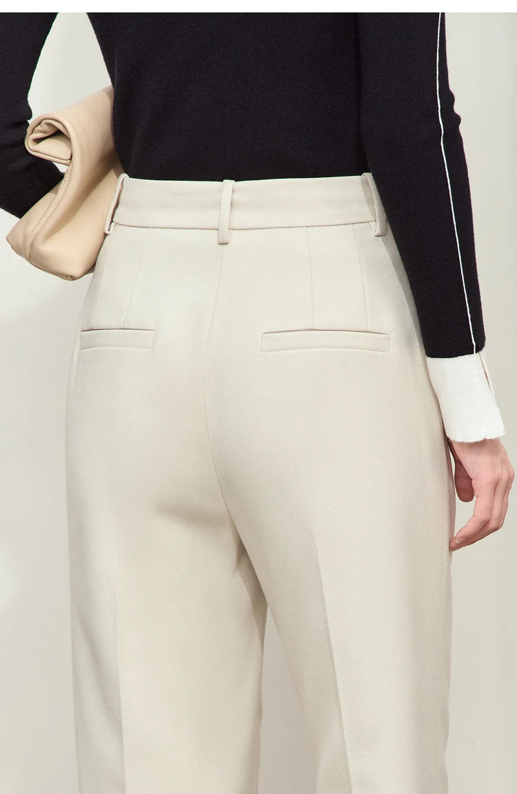 Upper back view of model in Moon Mist trousers — smooth waistline and minimal pocket detail. From Borcelleclothes.
