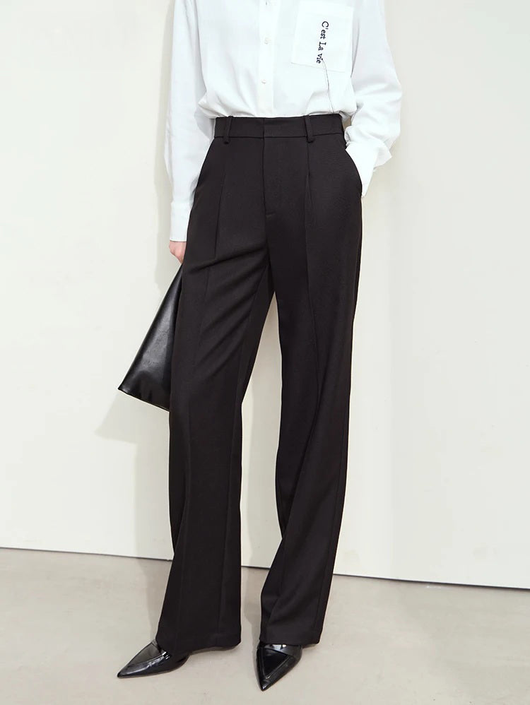 Tailored loose-fitting trousers in Onyx— modern silhouette with clean lines, subtle pleats, and no hint of retro. From Borcelleclothes.