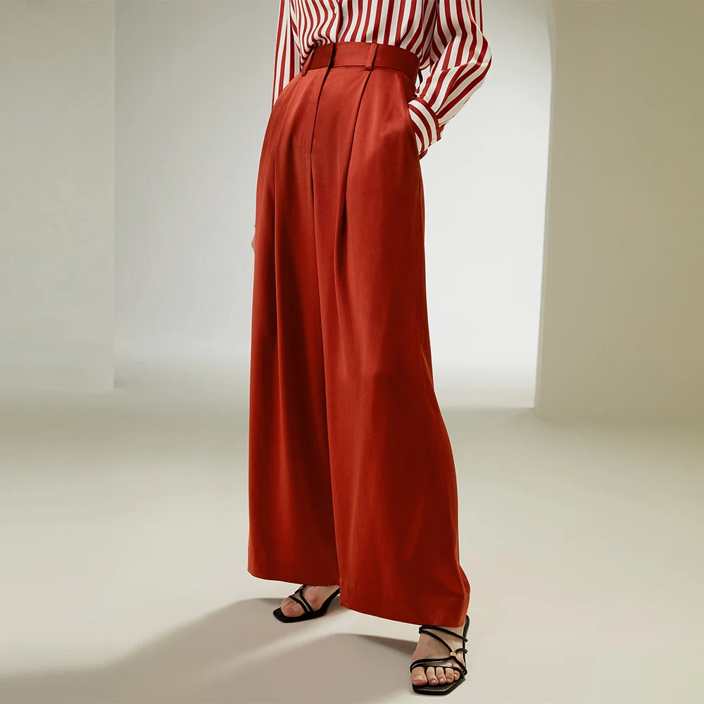 Women's tailored wide-leg silk trousers in Burnt Red highlighting fluid drape and structured elegance. From Borcelleclothes.
