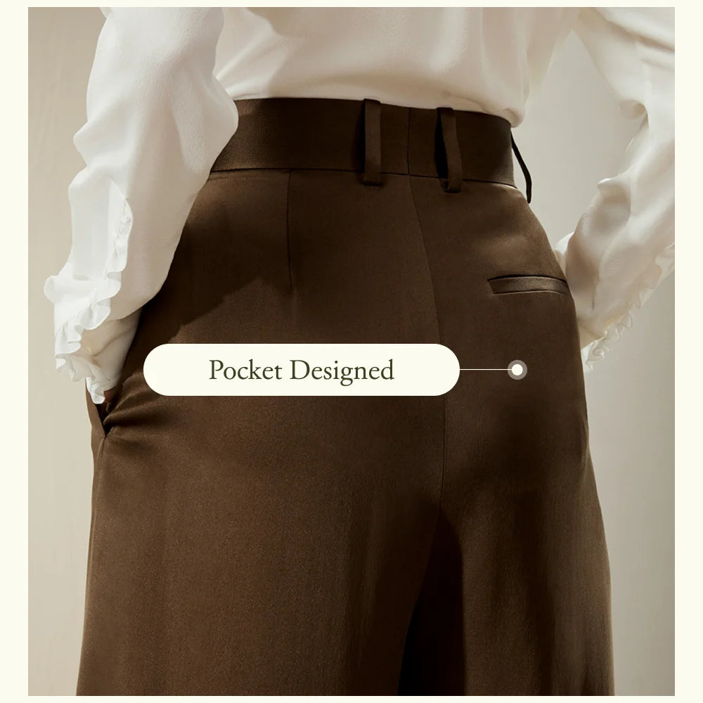 Back upper view of the Cafe Noir silk trousers, highlighting the smooth fall and minimalist construction. From Borcelleclothes.