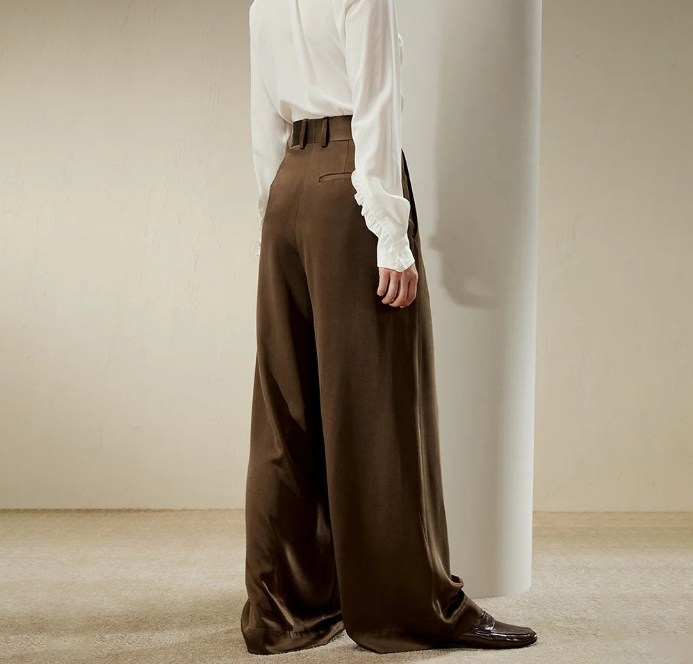 Side view of the Cafe Noir silk trousers, emphasizing the wide-leg silhouette and elegant drape. From Borcelleclothes.
