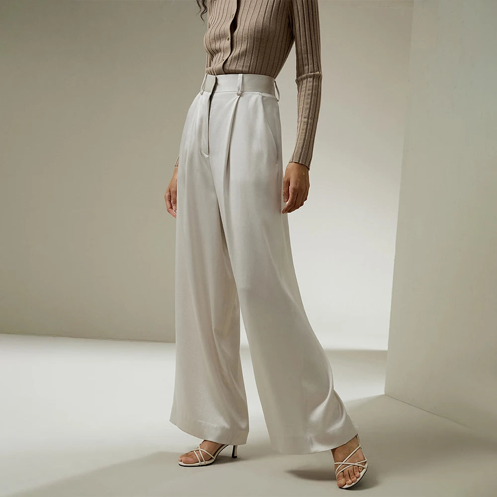 Women's tailored wide-leg silk trousers in Platinum, highlighting fluid drape and structured elegance. From Borcelleclothes.