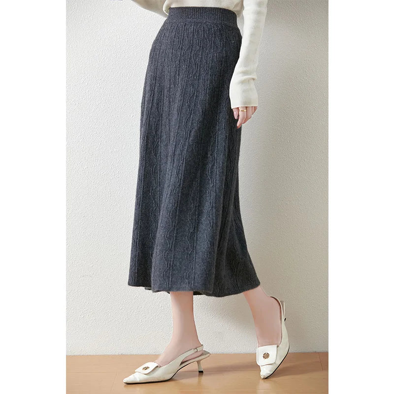 Davy Grey textured merino skirt, model turned slightly to the side, revealing fluid silhouette and soft vertical pattern — From Borcelleclothes.