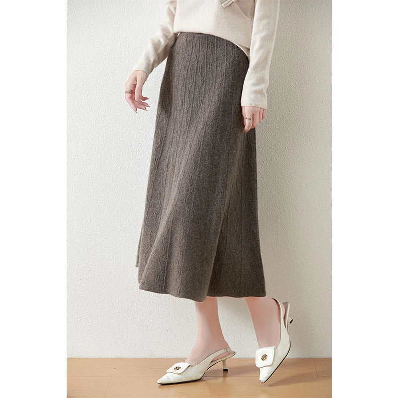 Jasper-colored textured merino skirt, model turned slightly to the side, highlighting knit texture and A-line silhouette — From Borcelleclothes.