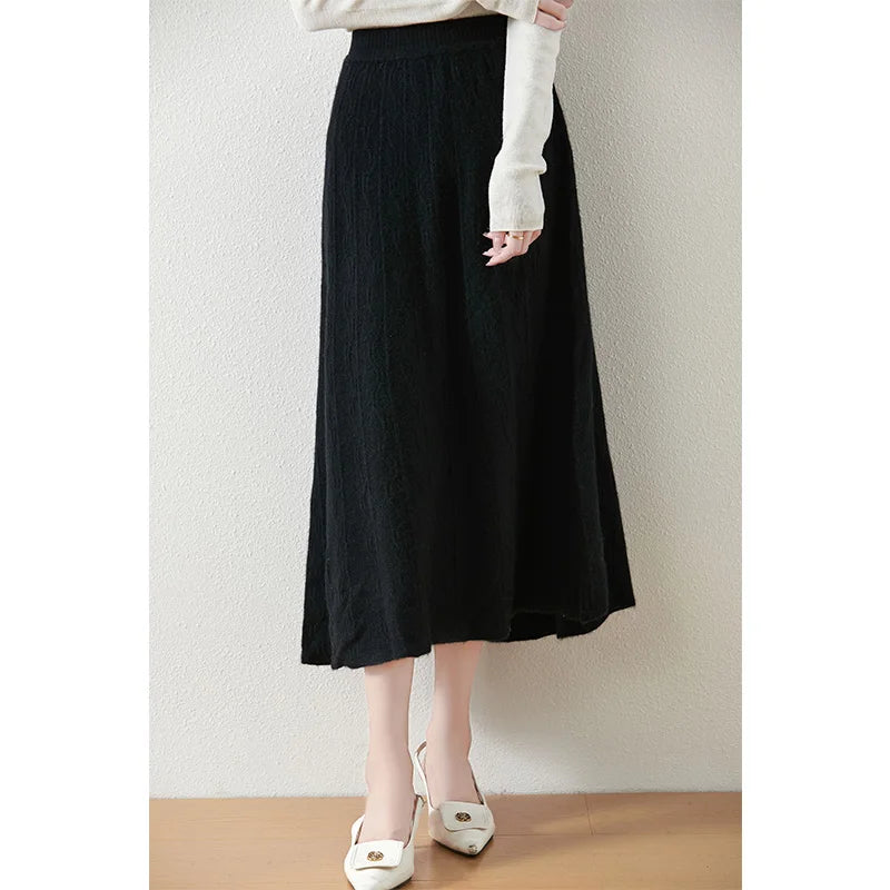 Women's A-line merino wool skirt in Onyx, with vertical and wave-textured knit, mid-calf length, in soft premium fabric — From Borcelleclothes.