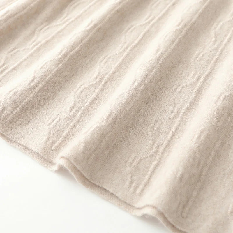 Bottom hem of Pale Silver textured merino skirt, showing subtle flare and soft structured finish — From Borcelleclothes.