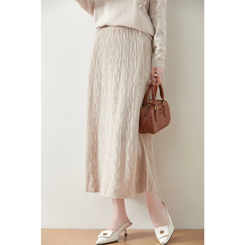 Textured merino wool skirt in Pale Silver, model turned slightly to the side, showing mid-calf drape and movement — From Borcelleclothes.