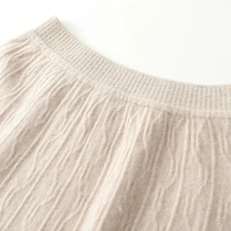 Upper section of textured merino wool skirt in Pale Silver, showing waistband and transition into soft abstract knit — From Borcelleclothes.