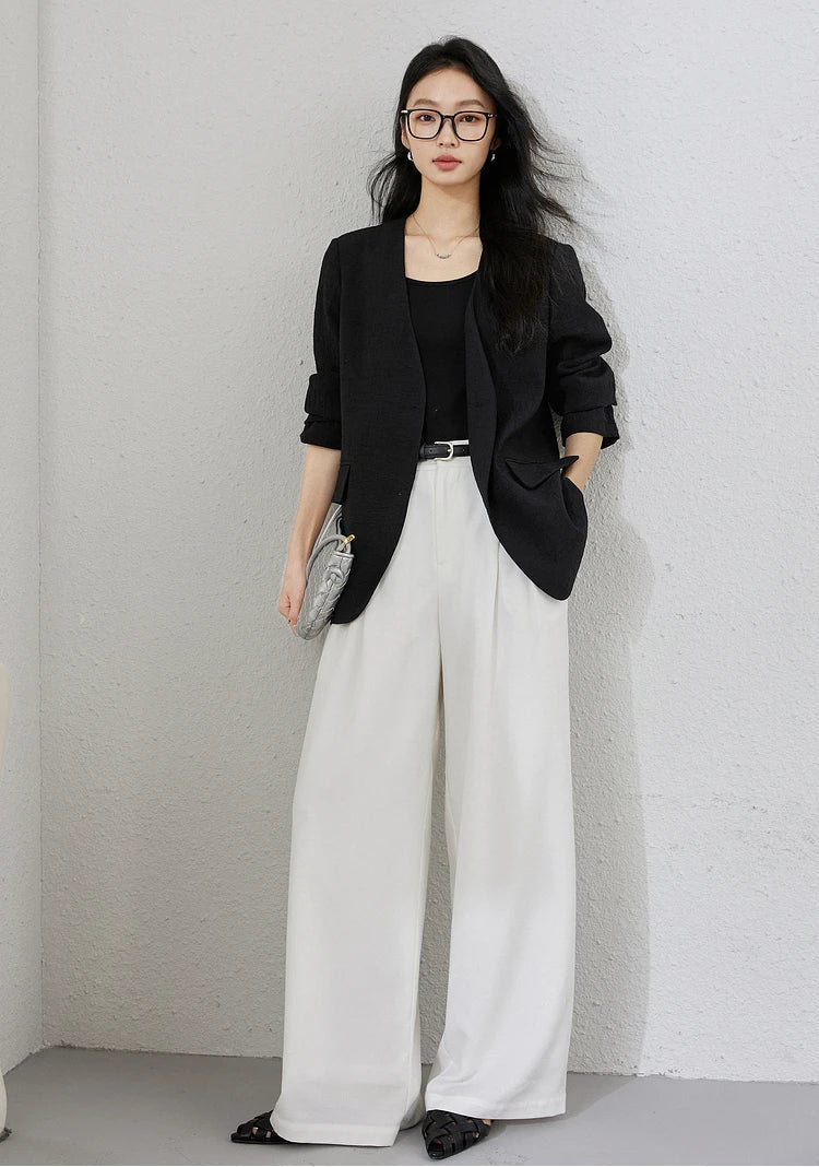 Women's textured pinstripe crinkle blazer in Onyx, hip-length with a clean V-neckline, defined by freedom. From Borcelleclothes.