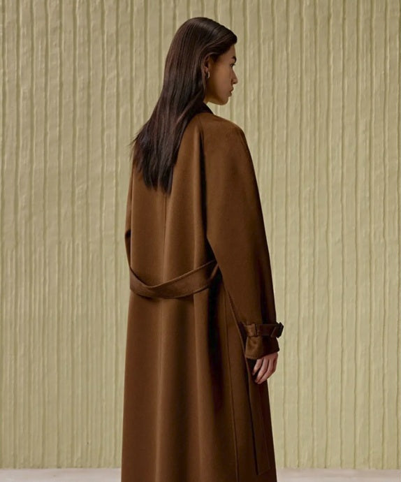 The back of the Women's Tibetan Cashmere Coat in Baker’s Chocolate, highlighting its streamlined silhouette and luxurious texture. From Borcelleclothes.