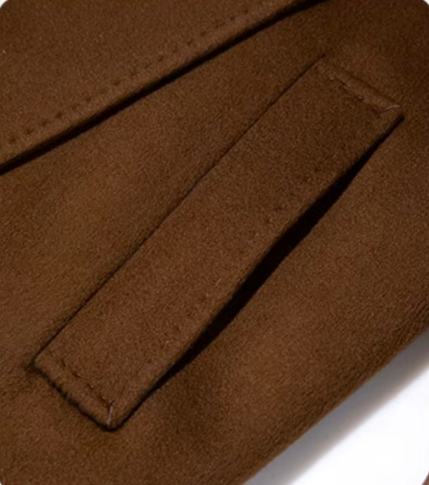 The diagonally exposed single-welt pocket of the Women's Tibetan Cashmere Coat in Baker’s Chocolate, emphasizing its functional elegance. From Borcelleclothes.