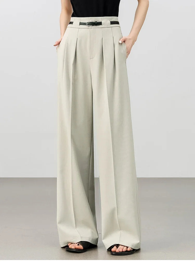 Women's tailored trousers in foggy grey, featuring partial waistband casings and deep front pleats for a structured yet fluid silhouette. From Borcelleclothes.