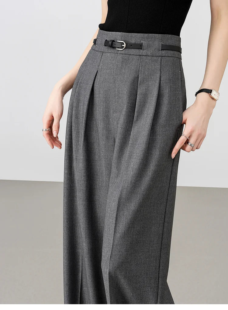 Model resting a thumb in the side pocket of storm dust trousers, highlighting ease, comfort, and tailored form. From Borcelleclothes.