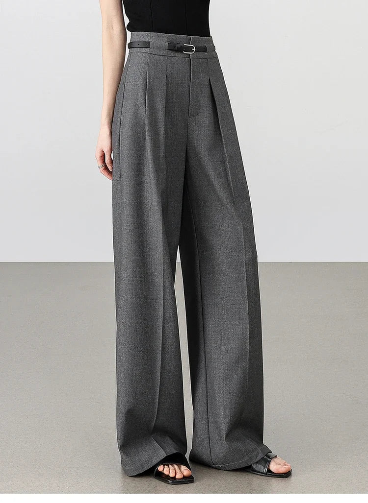 Women's tailored trousers in Storm Dust, featuring partial waistband casings and deep front pleats for a structured yet fluid silhouette. From Borcelleclothes.