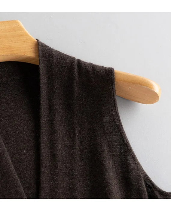 Shoulder detail of the Black Coffee V-neck cashmere top on hanger — From Borcelleclothes.