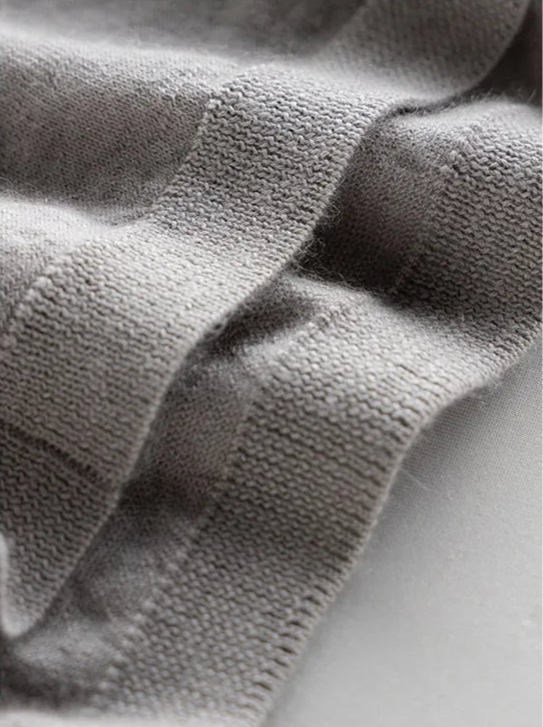 Bottom hem detail of the Morning Mist V-neck cashmere top — From Borcelleclothes.