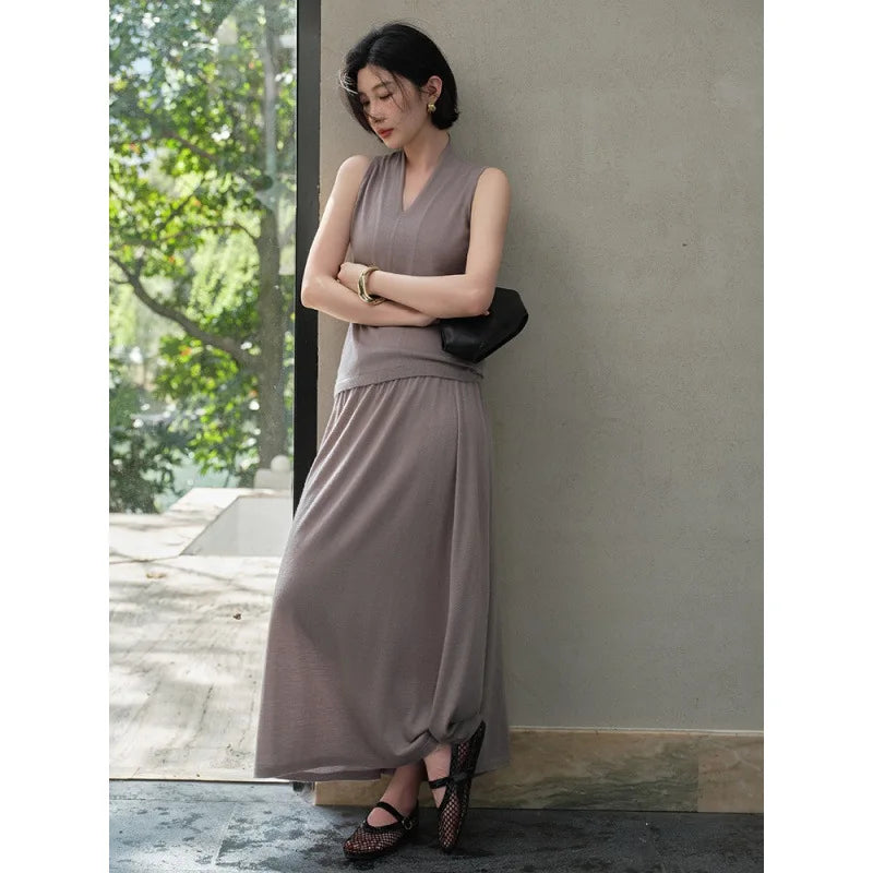 Model in Morning Mist cashmere top, looking to the side with arms crossed — From Borcelleclothes.