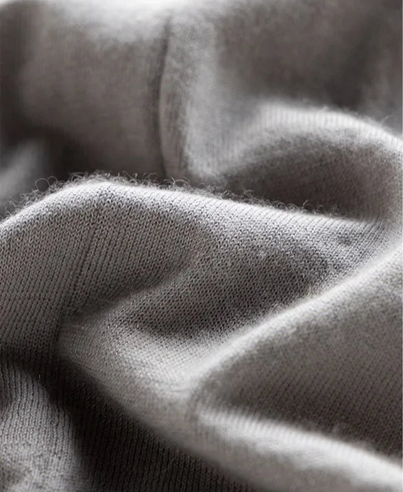 Wave-folded texture of the Morning Mist V-neck cashmere top displayed in detail — From Borcelleclothes.