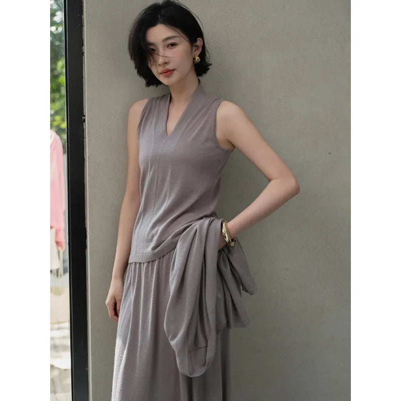 Women’s V-neck cashmere top in Morning Mist, with soft front draping and a sculptural collar framing the neckline — From Borcelleclothes.