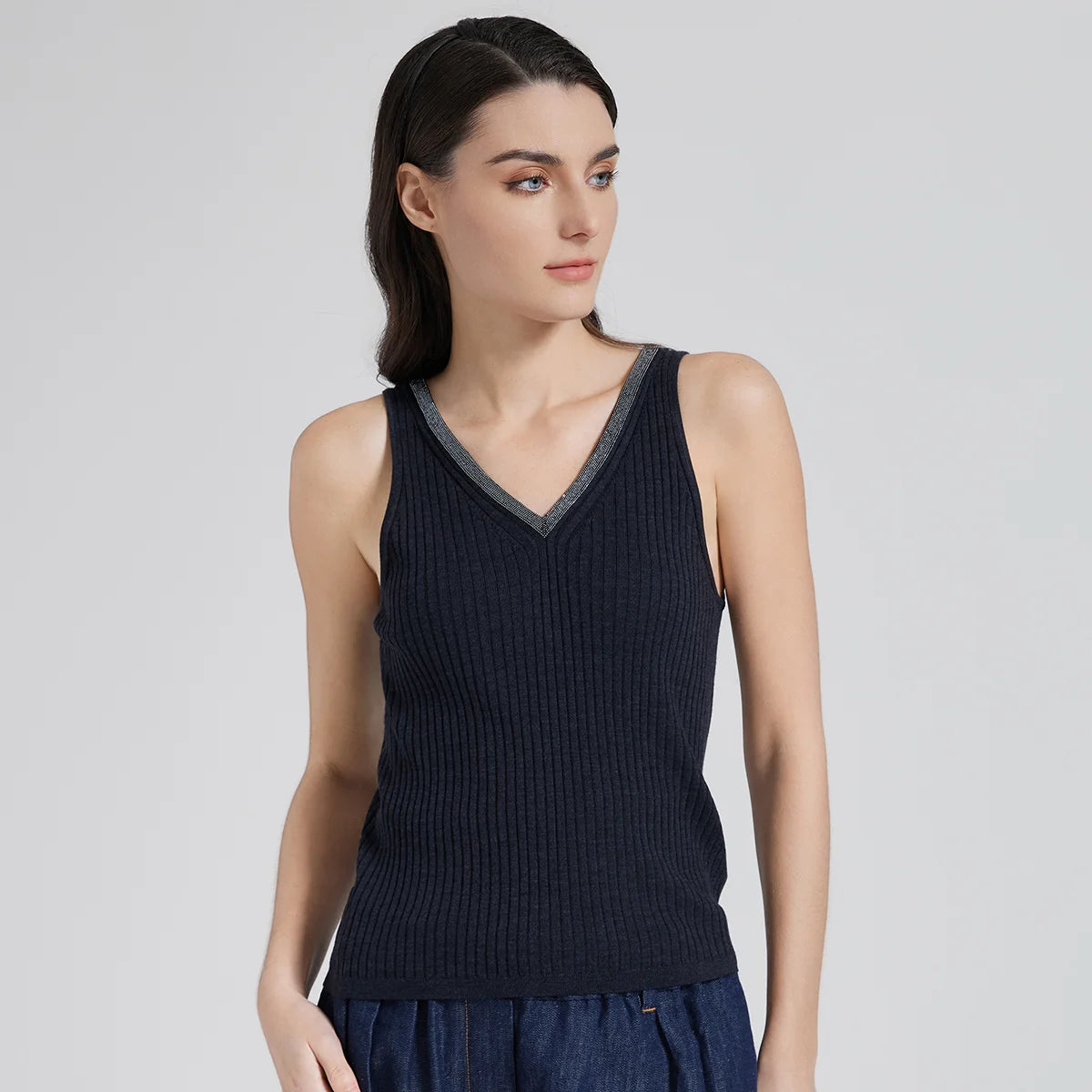 Women’s slim-fit wide-rib wool and silk top in Black Pearl with front and back V-necklines and delicate rhinestone fringe at the front. From Borcelleclothes.