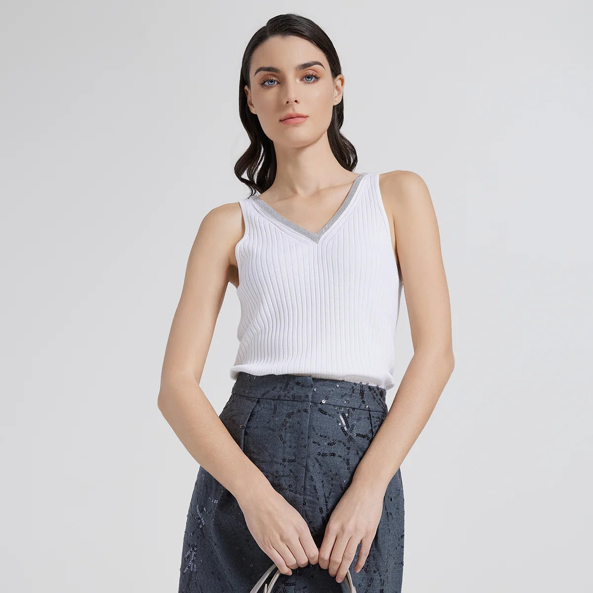 Women’s slim-fit wide-rib wool and silk top in White Lilac with front and back V-necklines and delicate rhinestone fringe at the front. From Borcelleclothes.