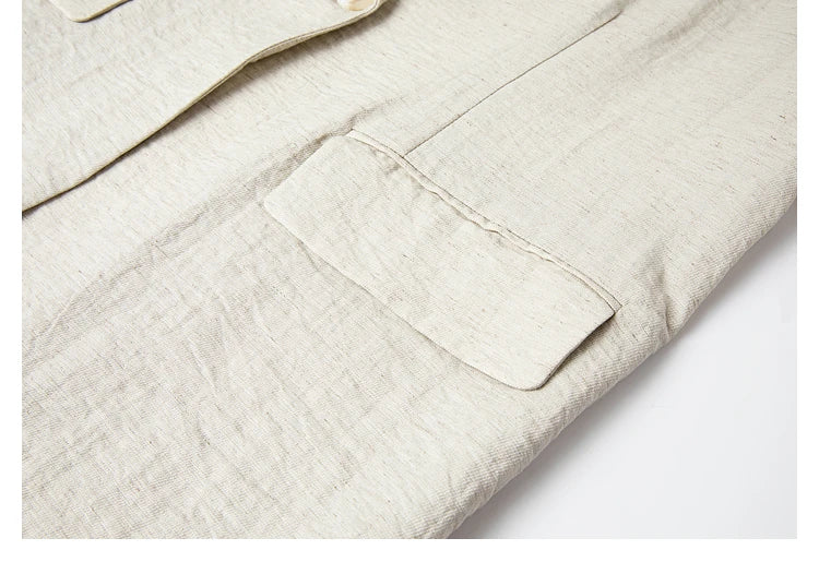 Side flap pocket of the blazer, highlighting the textured fabric. From Borcelleclothes.
