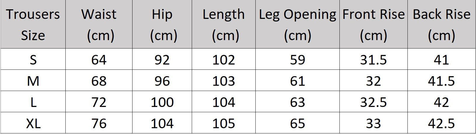 Women's size chart for trousers of the two-piece set in Wild Sand, featuring a short-sleeved blazer with notch lapels and crinkled wide-leg trousers, shown in natural light. From Borcelleclothes.