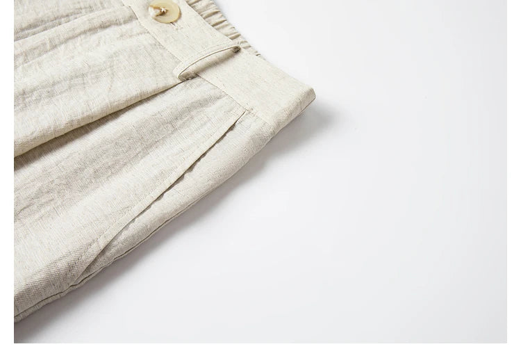 Close-up of the trousers’ side slash pocket with subtle crinkle texture. From Borcelleclothes.