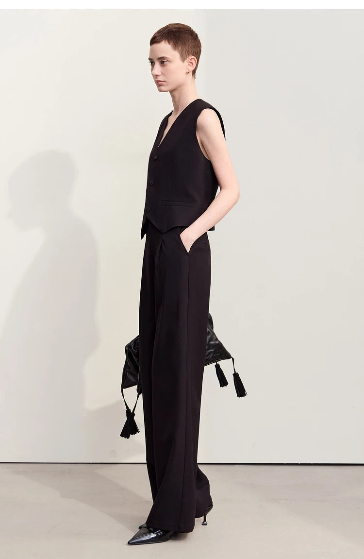 Side view of the Onyx trousers — straight-leg cut and subtle pleats providing freedom of movement with intention. — From Borcelleclothes.
