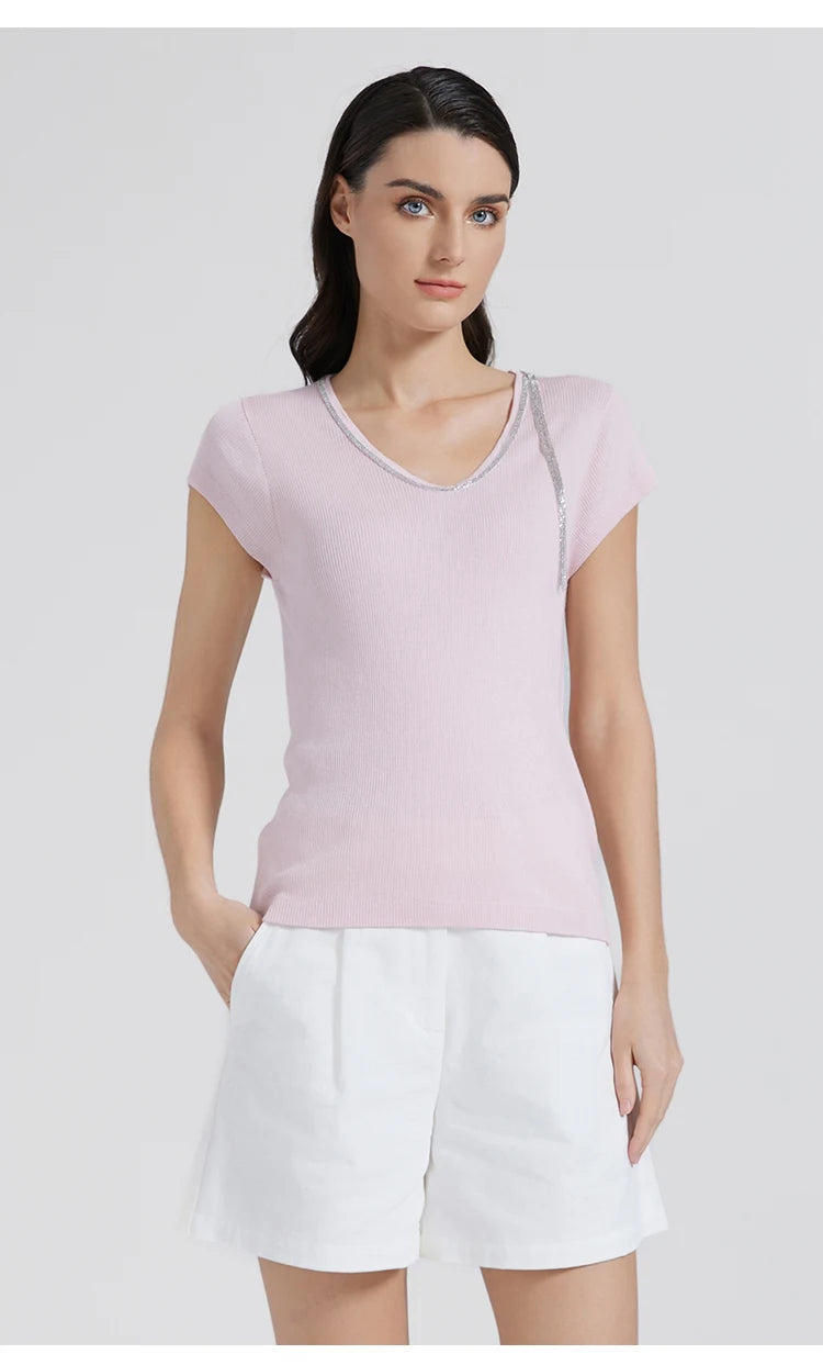 Full look featuring the Prim wool-silk top with rhinestone trim, paired with white tailored shorts. From Borcelleclothes.