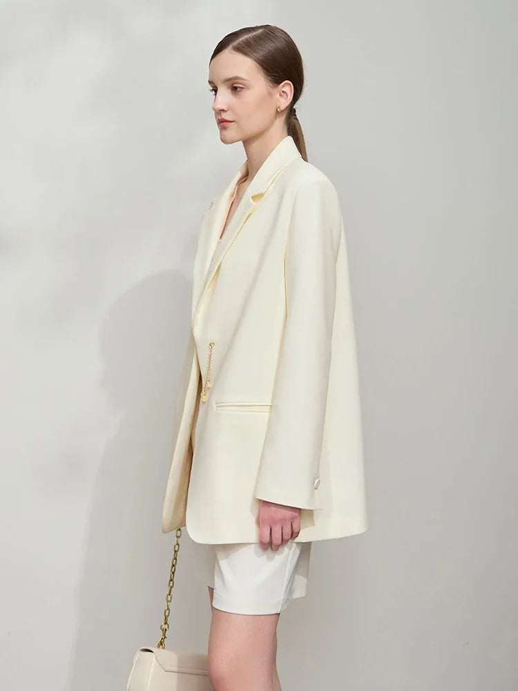 Left side view of women’s Pearl Bush wrap blazer with golden pendant – From Borcelleclothes.