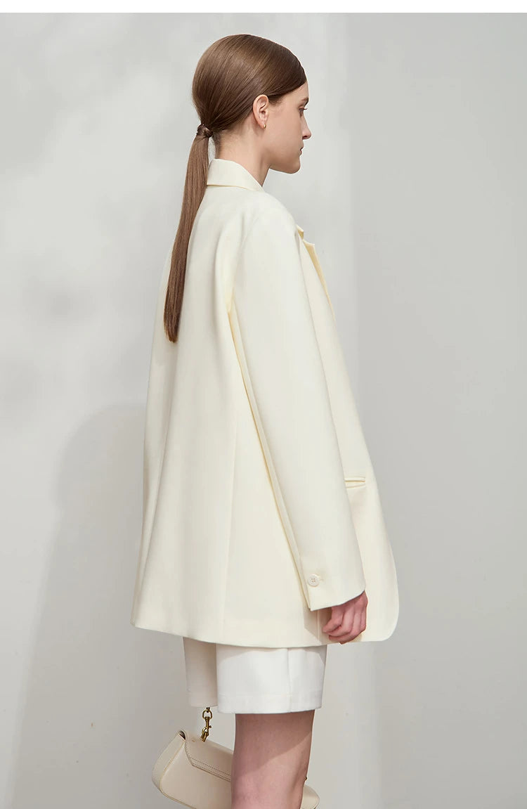 Right side view of women’s Pearl Bush wrap blazer with golden pendant – From Borcelleclothes.